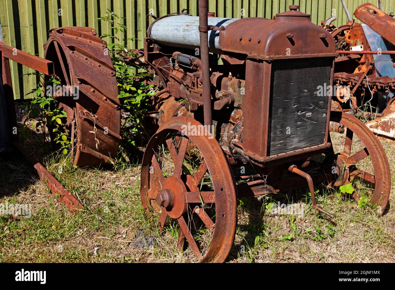 a very old and rusty tractor Stock Photo