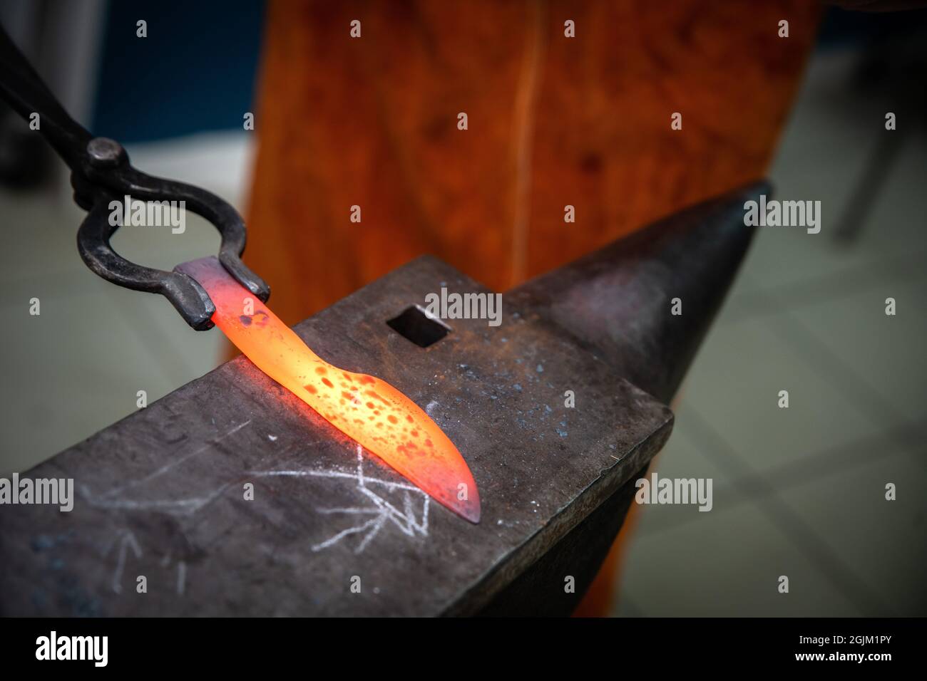 man hands are manufacturing a steel knife Stock Photo Alamy