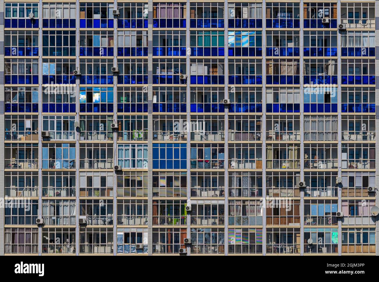 Pattern from colorful balconies in modern residential building. The
