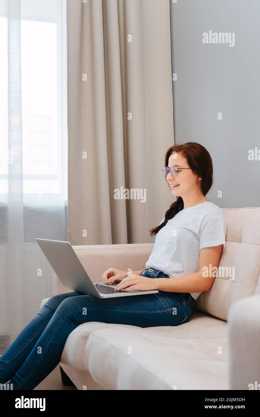 Young female student on distance learning. Stock Photo