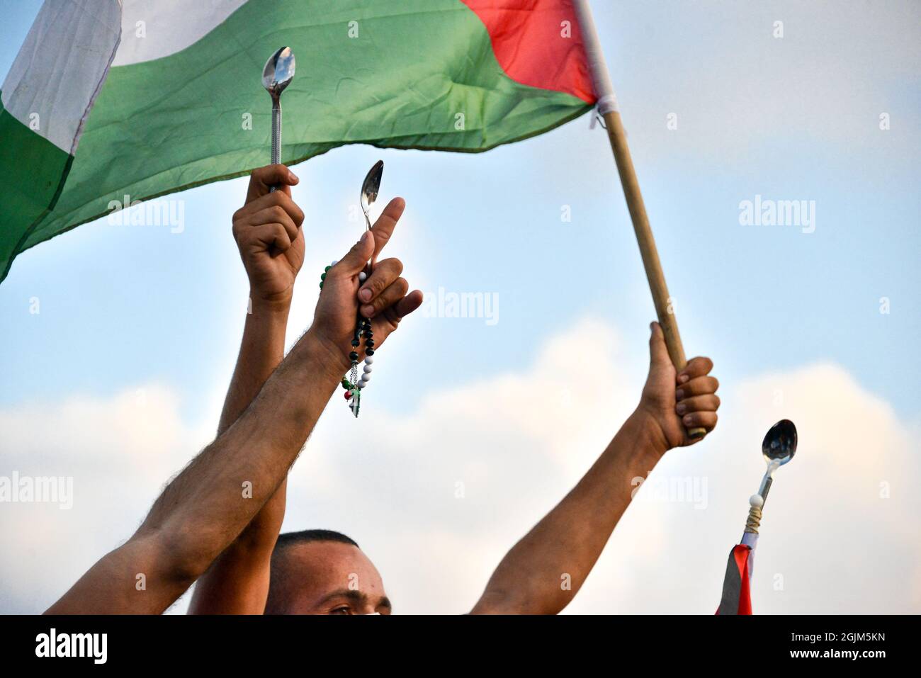 Palestine. 10th Sep, 2021. Arab Israeli protestors waving Palestine flags and spoons, which were used for the escape of the six Palestinian prisoners from the Gilboa Prison this week. The protest in Umm al-Fahm today condemned punishment measures taken after the jailbreak by the Israeli Prison Services and against violent interrogation means. According to some statistics, one out of five Palestinian men was imprisoned in Israeli jails during his lifetime. Umm al-Fahm, Israel, on Sep 11th 2021.  (Photo by Matan Golan/Alamy Live News) Credit: Matan Golan/Alamy Live News Stock Photo