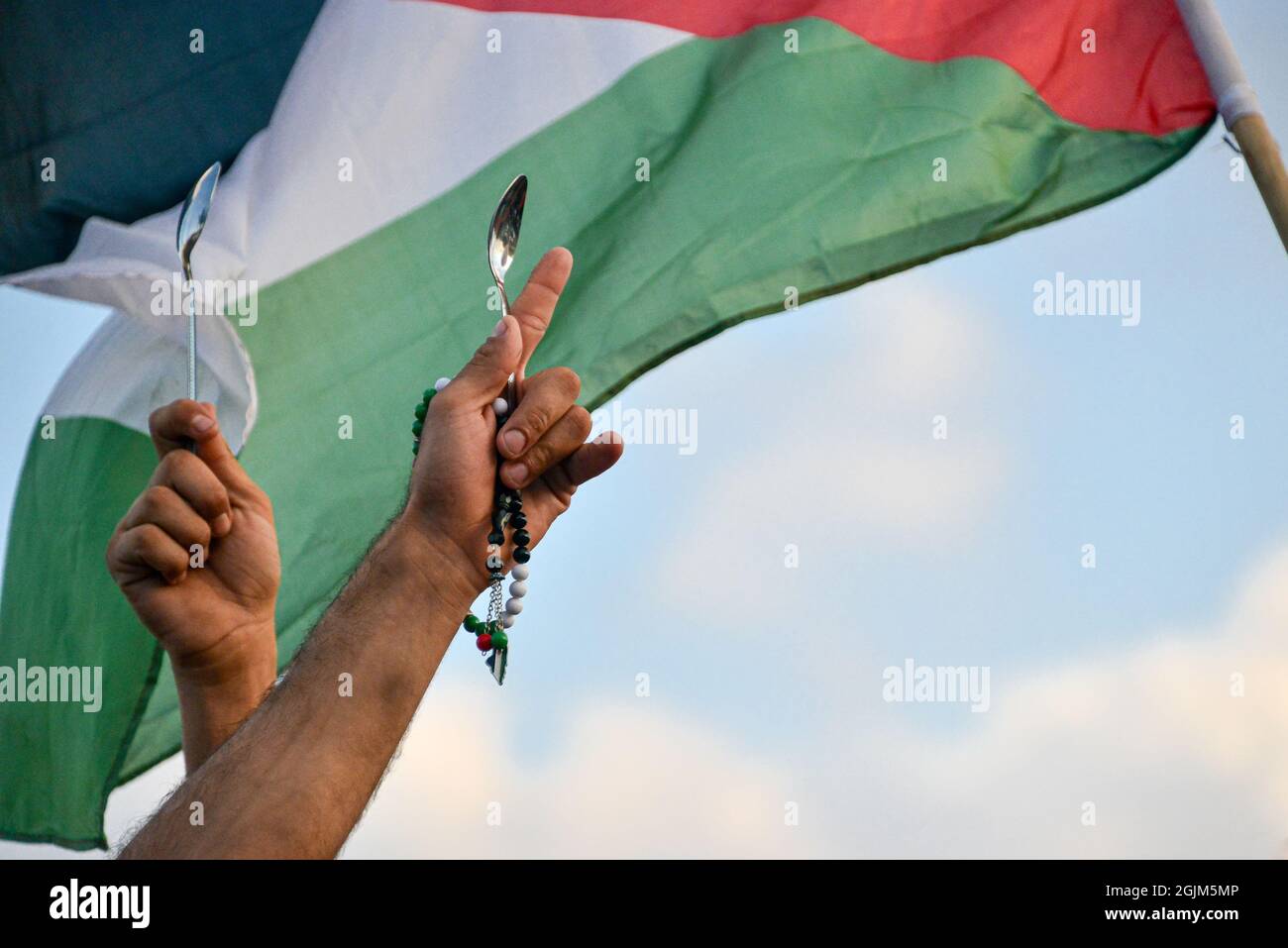 Palestine. 10th Sep, 2021. Arab Israeli protestors waving Palestine flags and spoons, which were used for the escape of the six Palestinian prisoners from the Gilboa Prison this week. The protest in Umm al-Fahm today condemned punishment measures taken after the jailbreak by the Israeli Prison Services and against violent interrogation means. According to some statistics, one out of five Palestinian men was imprisoned in Israeli jails during his lifetime. Umm al-Fahm, Israel, on Sep 11th 2021.  (Photo by Matan Golan/Alamy Live News) Credit: Matan Golan/Alamy Live News Stock Photo