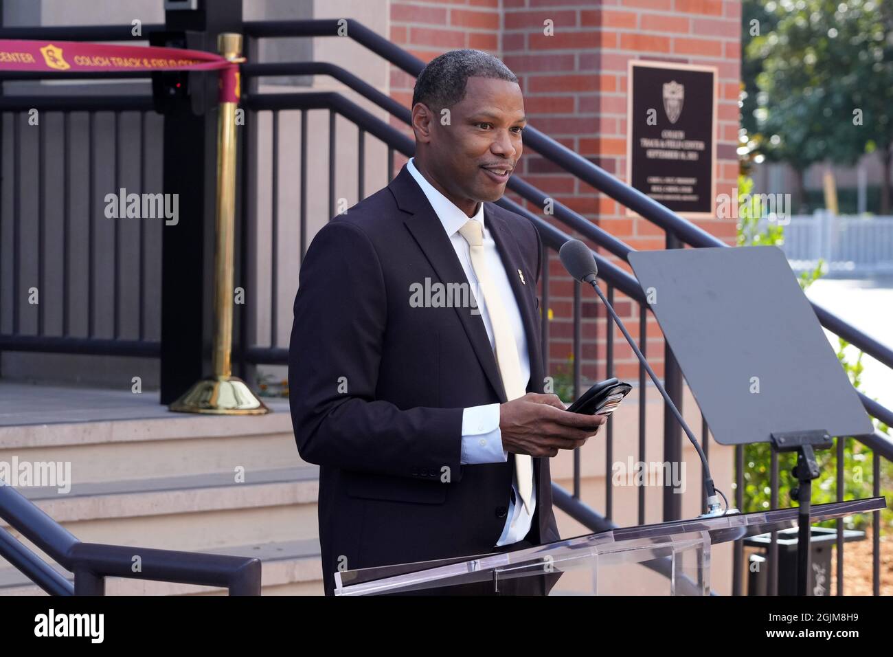 Quincy Watts speaks during a ceremony to dedicate the Colich Track and