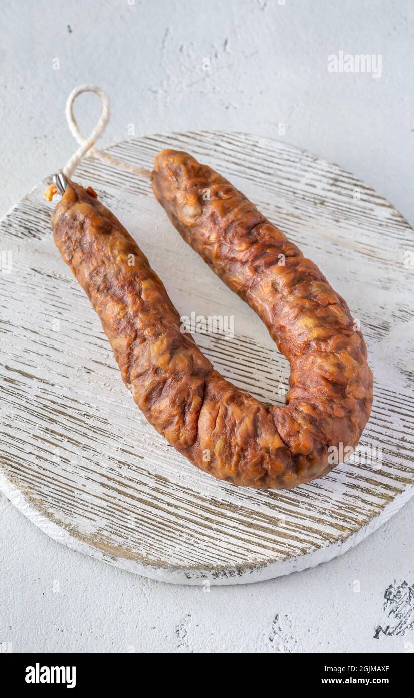 Spanish chorizo sausage on the white background Stock Photo - Alamy