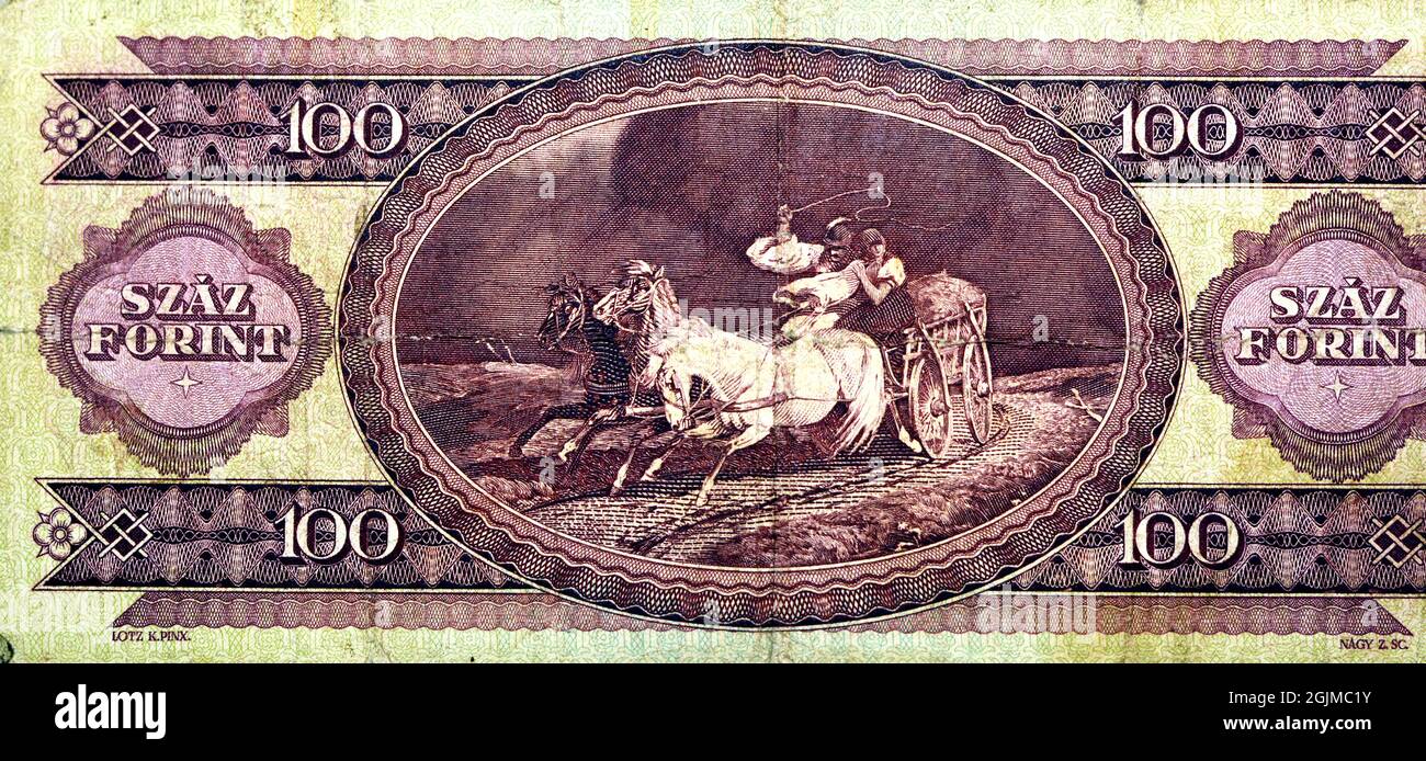 Reverse side of 100 one hundred Forint banknote currency 1984 by Magyar bank features Horse carriage from a painting Took Refuge from the Storm by Lot Stock Photo