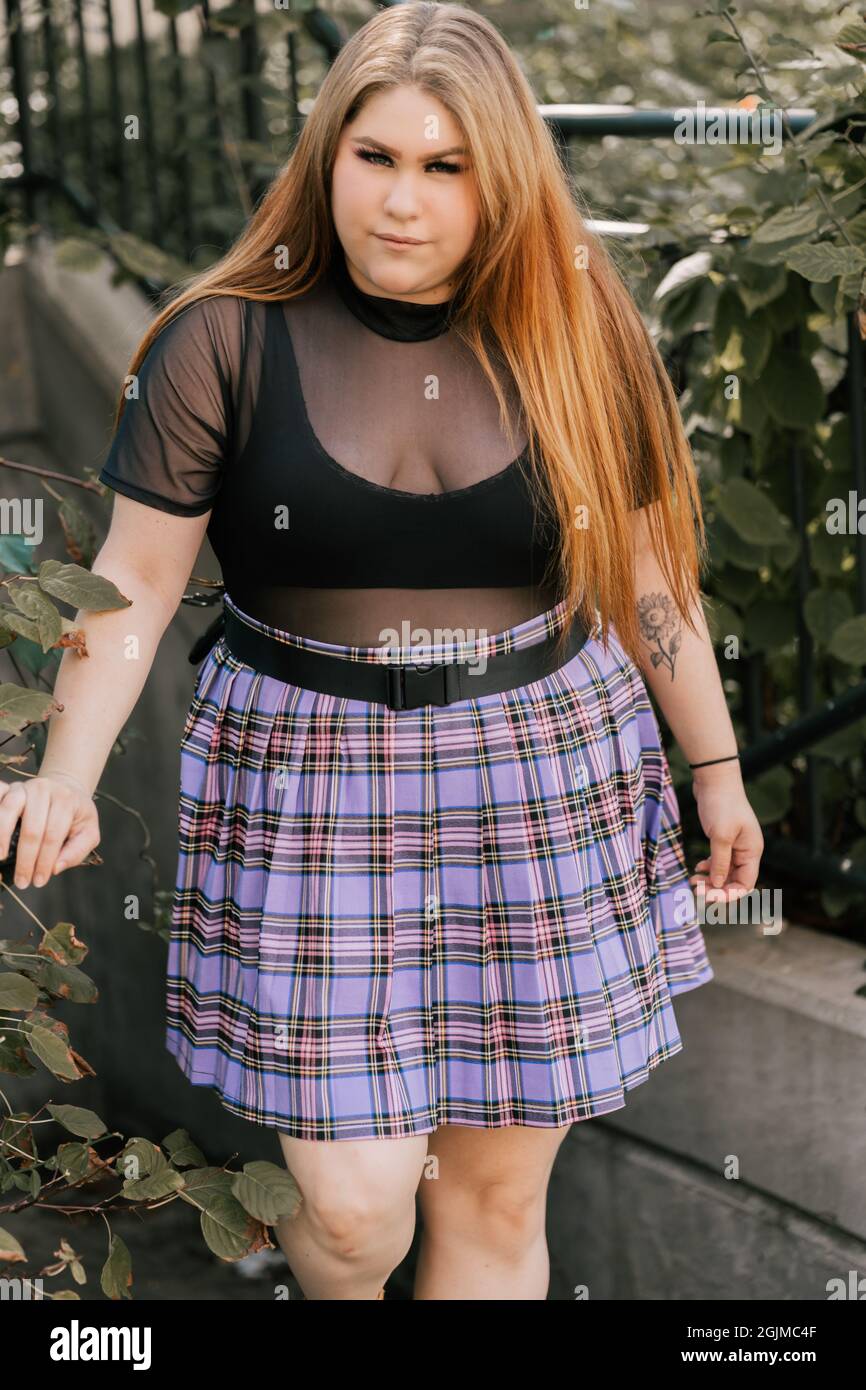 Trendy plus size woman in mini skirt Stock Photo - Alamy