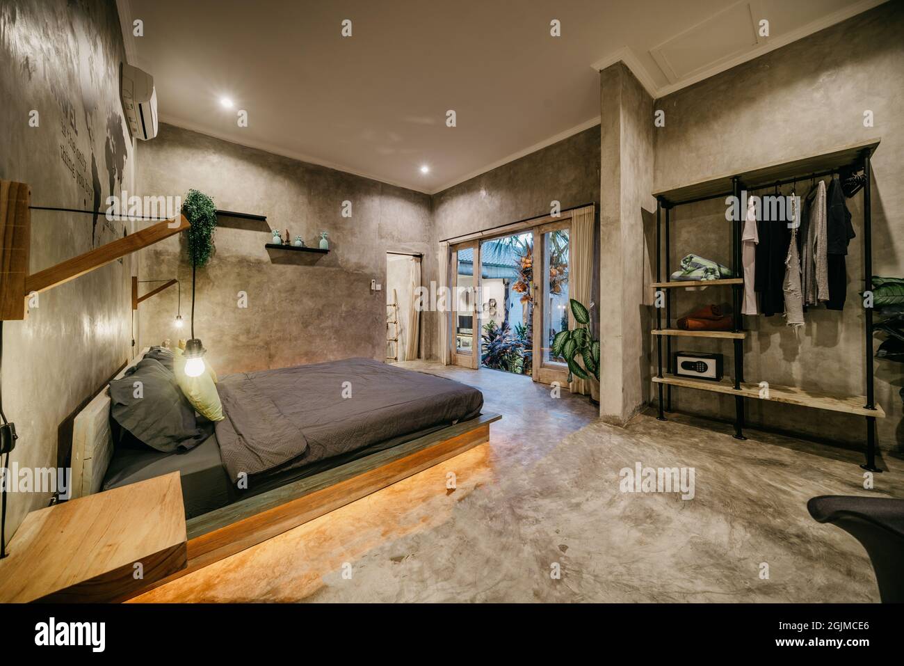 Luxury bedroom with modern wooden bed in loft style interior design ...