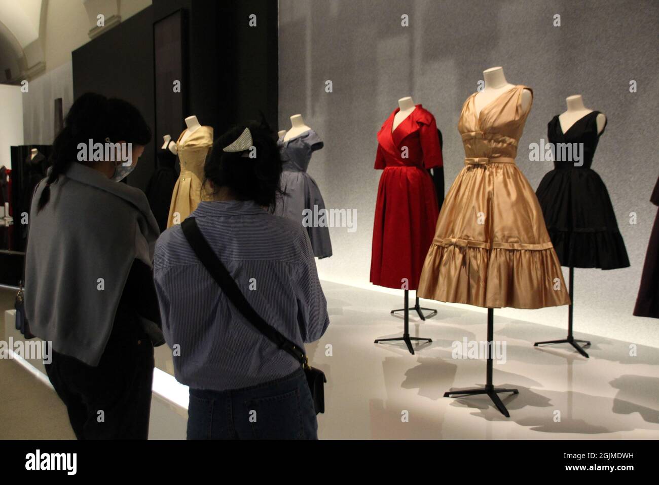 New York, USA. 10th Sep, 2021. Visitors look at dresses from the exhibition honoring French fashion designer Dior at the Brooklyn Museum. The opulent show, which will be on display until February 2022, features garments and accessories as well as drawings, photographs and films. Credit: Christina Horsten/dpa/Alamy Live News Stock Photo