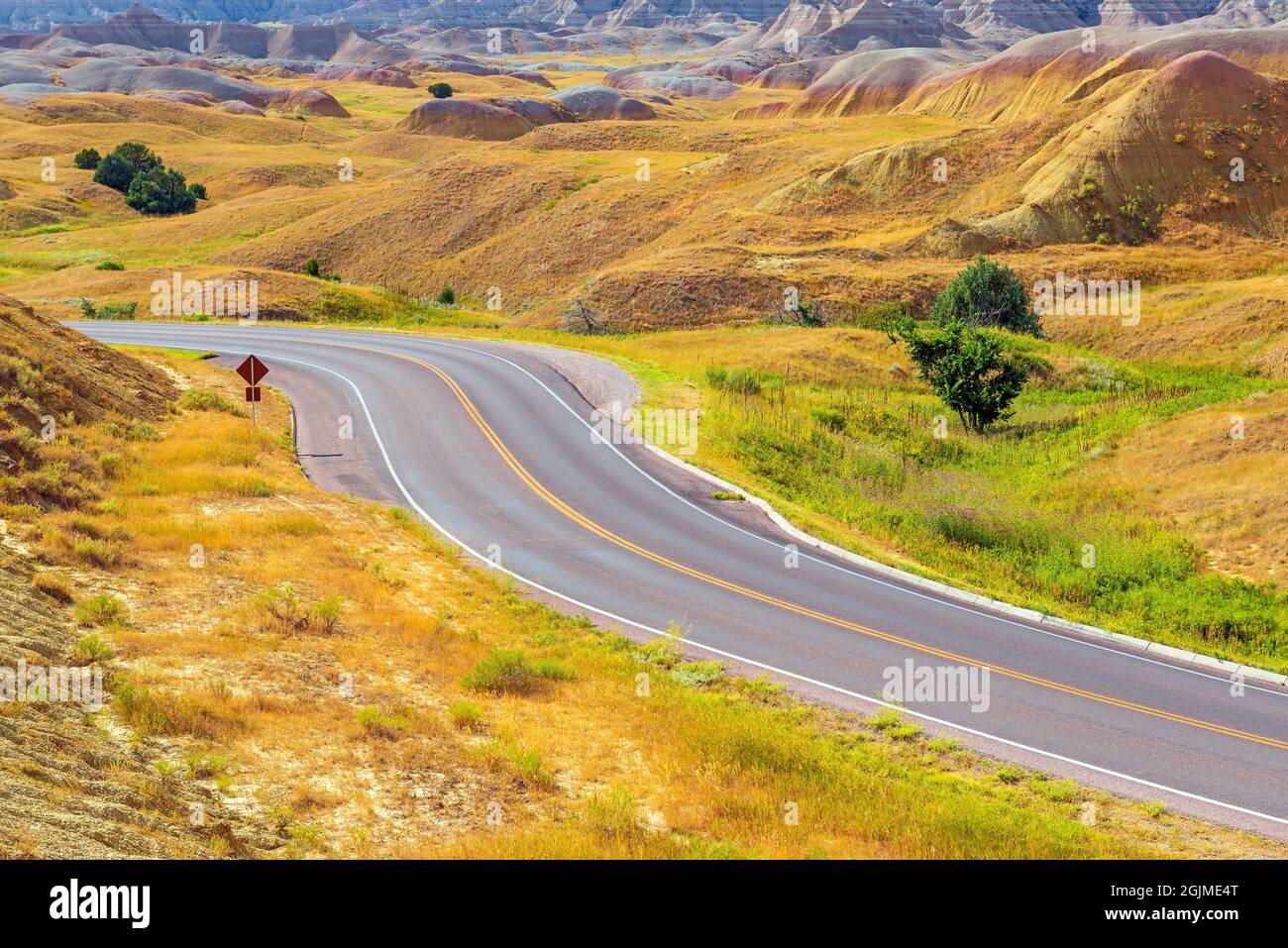 On the road highway by the Yellow Mounds, Badlands national park, South Dakota, USA. Stock Photo