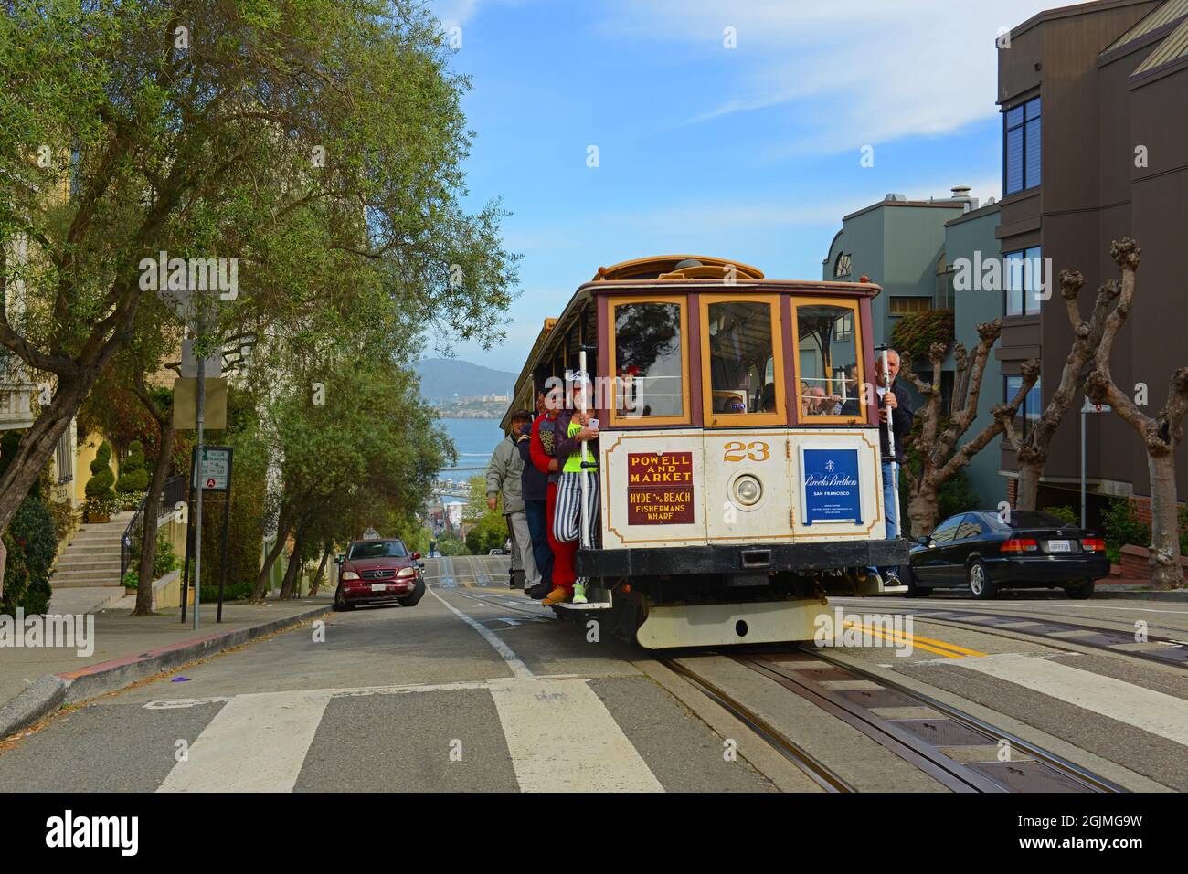 Antique Cable Car Powell Hyde Line on Hyde Street at Lombard Street with Alcatraz Island at the