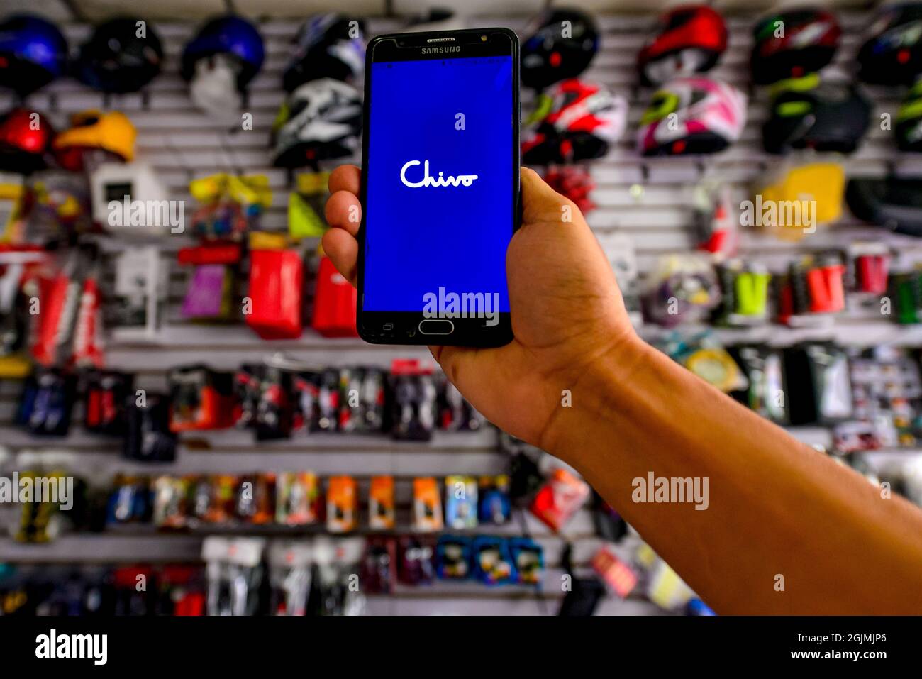 A Chivo wallet app is seen displayed on a smart phone screen during the  Cryptocurrency legal tender.The Echeveria Importer business, where  motorcycle repair parts are sold has decided to register as a