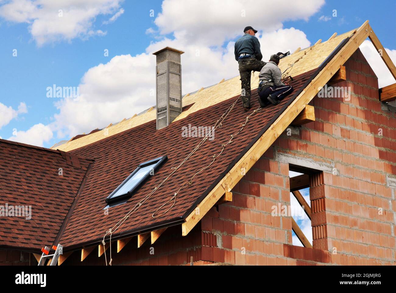 Roofing preparation asphalt shingles installing on house construction  wooden roof with bitumen spray and protection rope, safety kit. Roofing  constru Stock Photo - Alamy