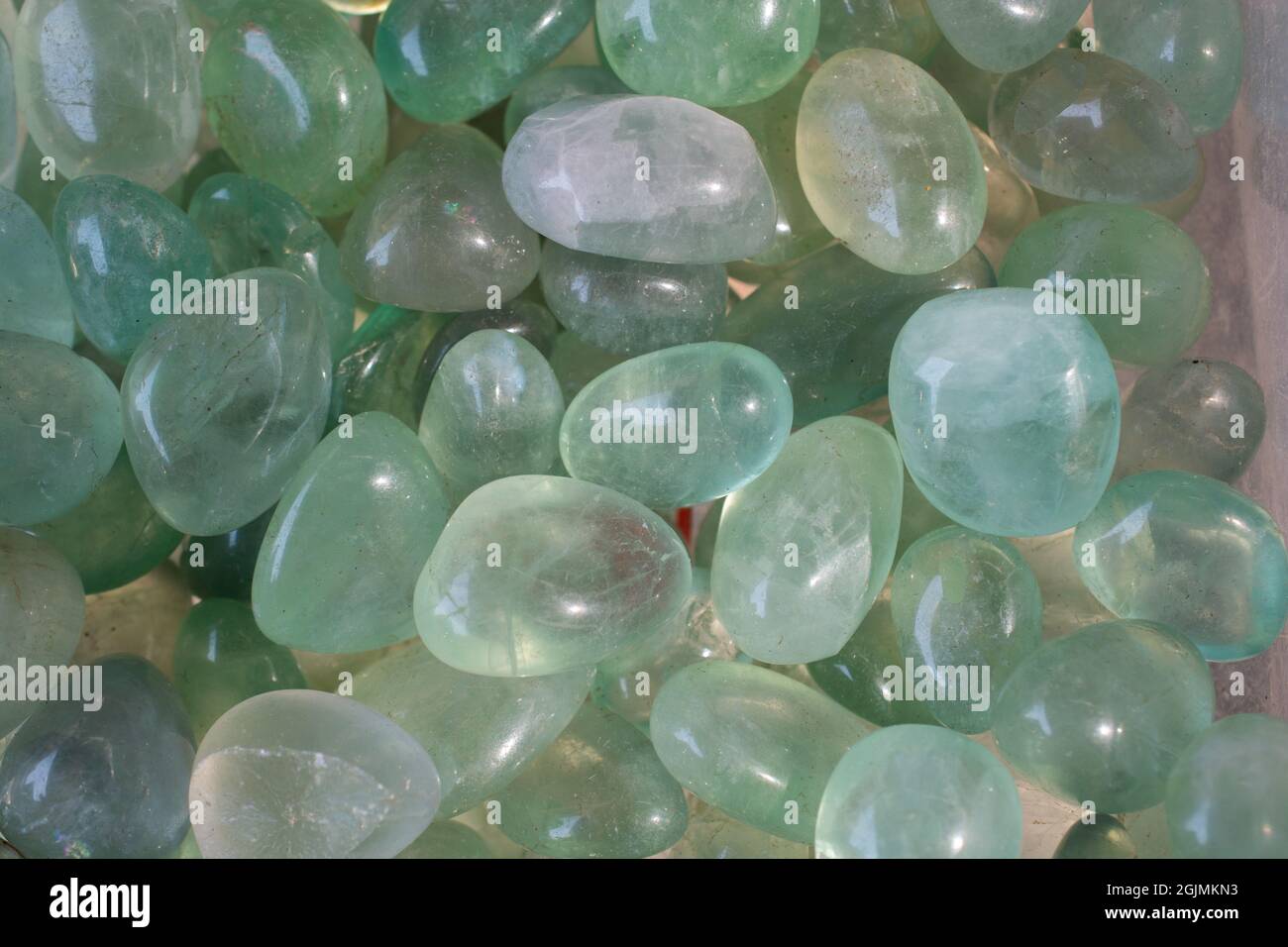 Closeup shot of green fluorite tumbling heap Stock Photo