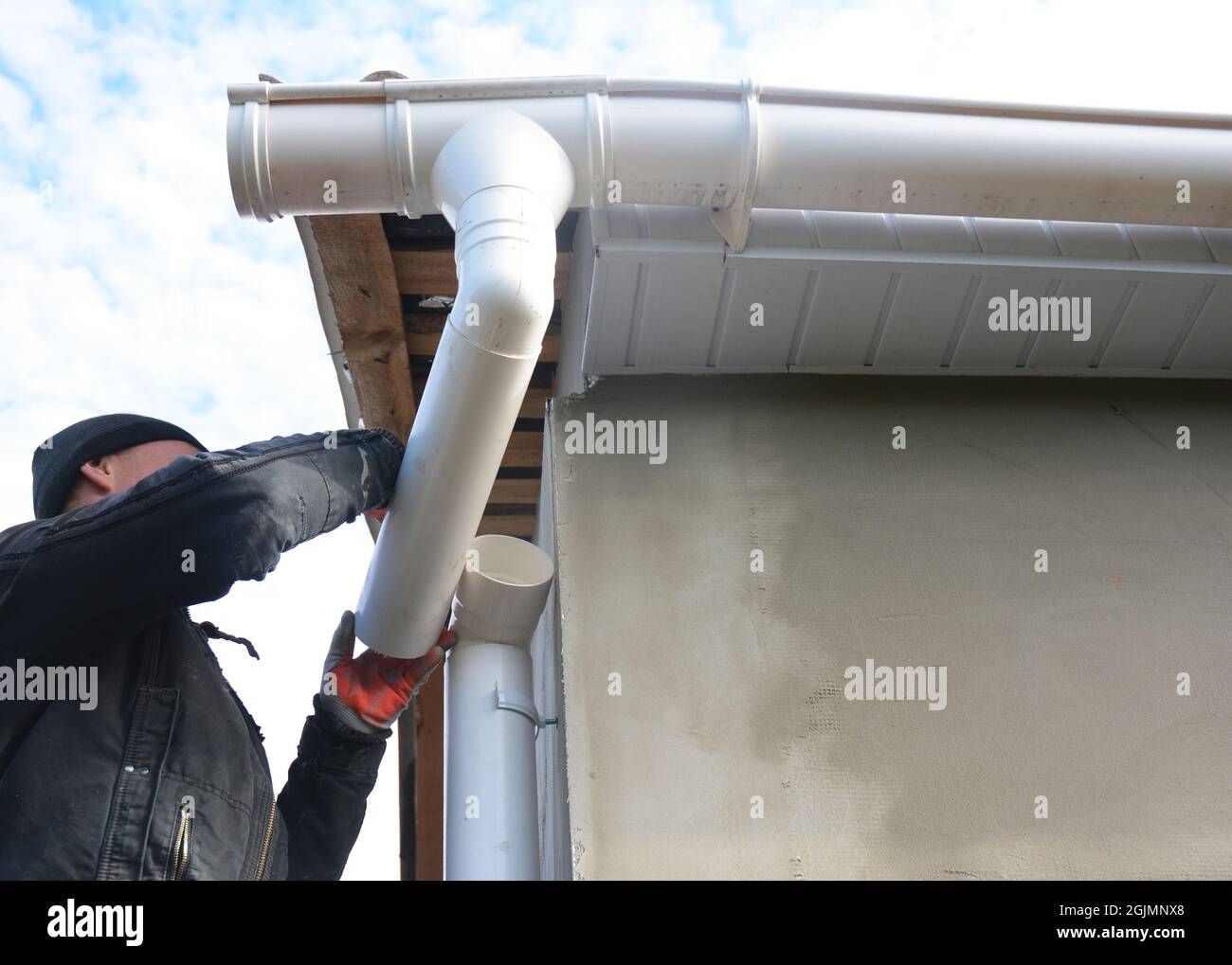 Roofer install and repair gutter system. Rain gutter installation with