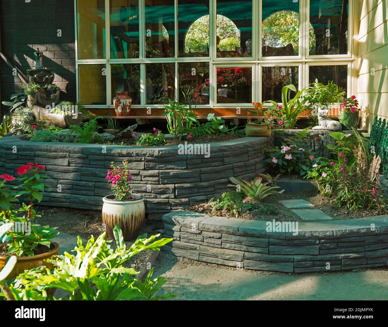 Garden with curved brick walls Stock Photo