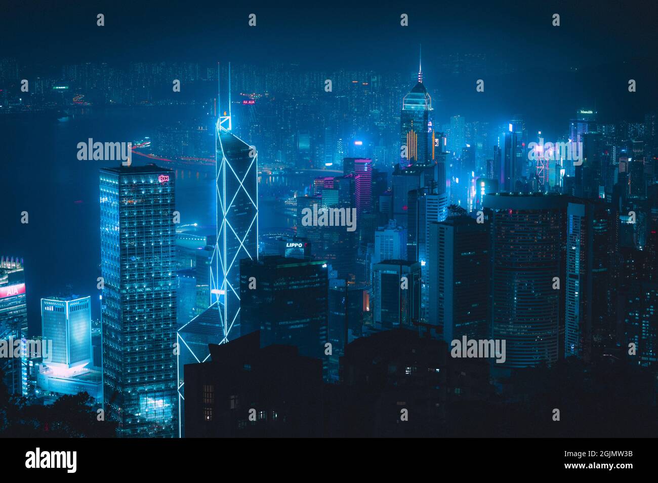 Modern city with skyscrapers illuminated with blue neon lights at night ...