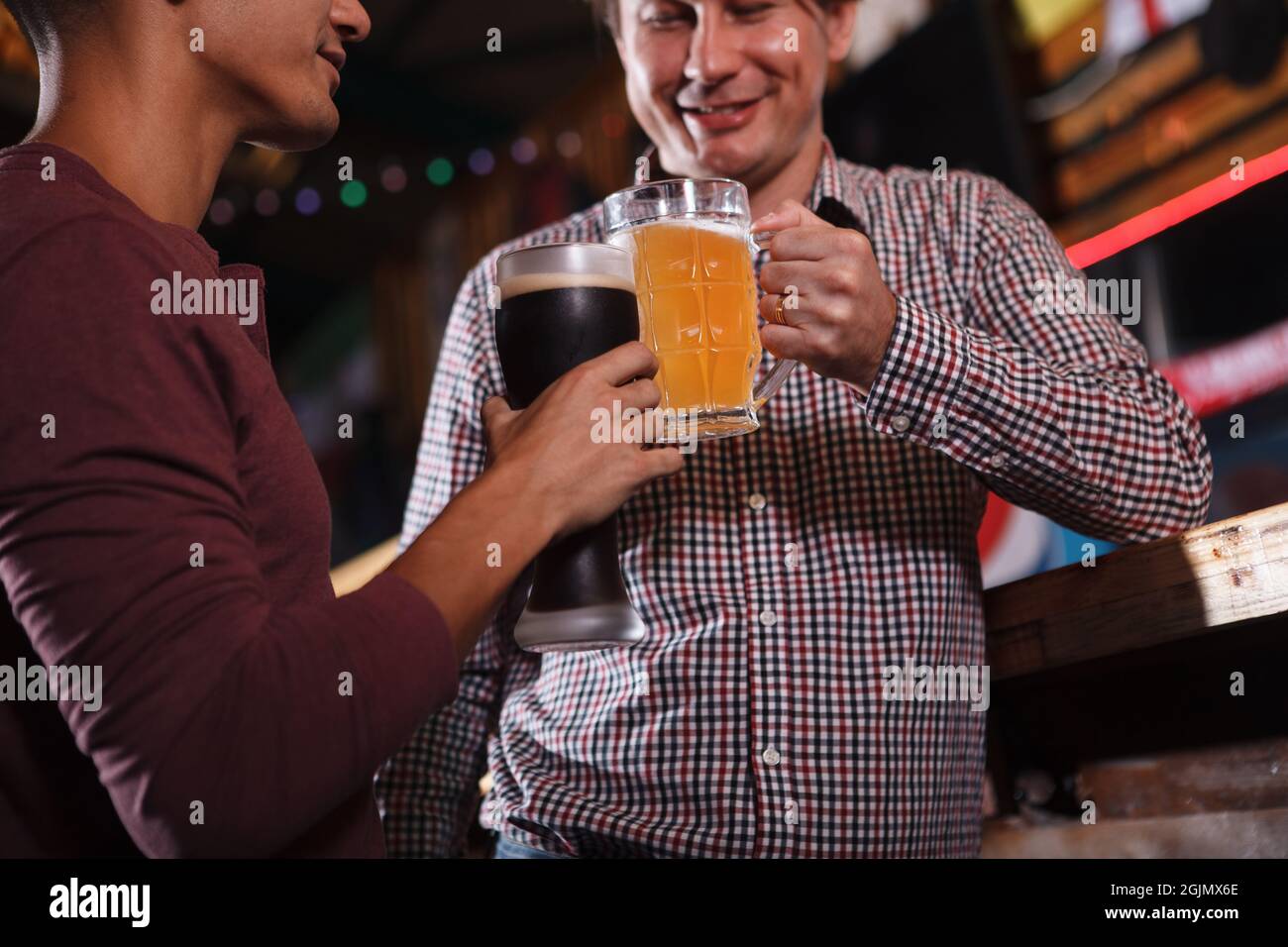 Cropped shot men clinking hi-res stock photography and images - Alamy