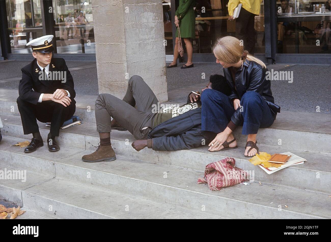 USA december 1968. Students at University of California Berkeley in typical 1968 clothes having a conversation with a young naval officer. Kodachrome slide original.   Credit Roland Palm ref 6-1-16 Stock Photo