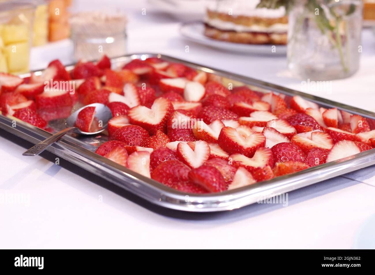 Group of people eating strawberries hi-res stock photography and images ...