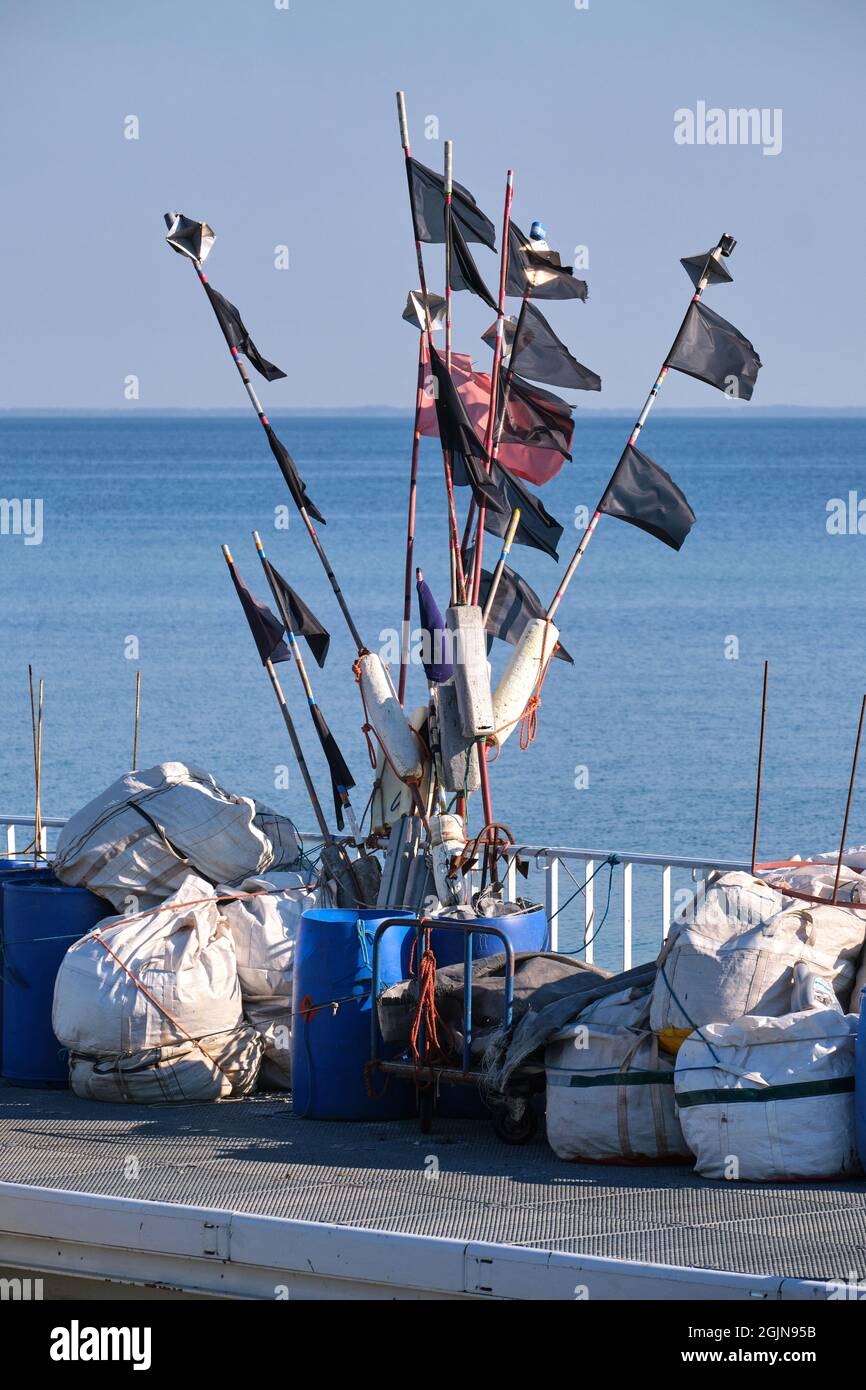 Black and red flags of fishing nets in Mechelinki small fishing port, Poland Stock Photo