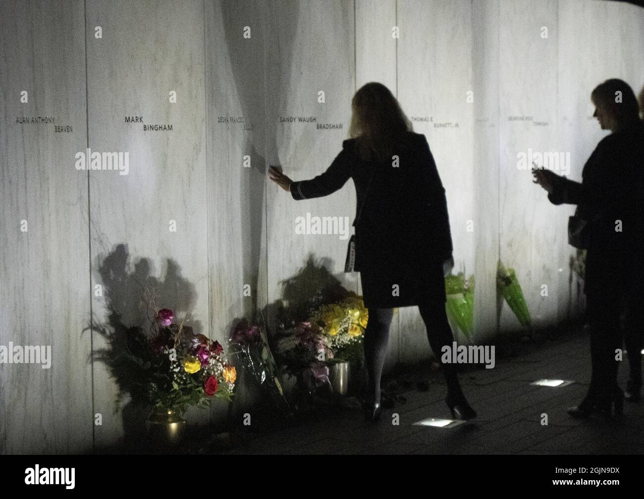 Shanksville, USA. 11th Sep, 2021. Visitors are silhouetted after the