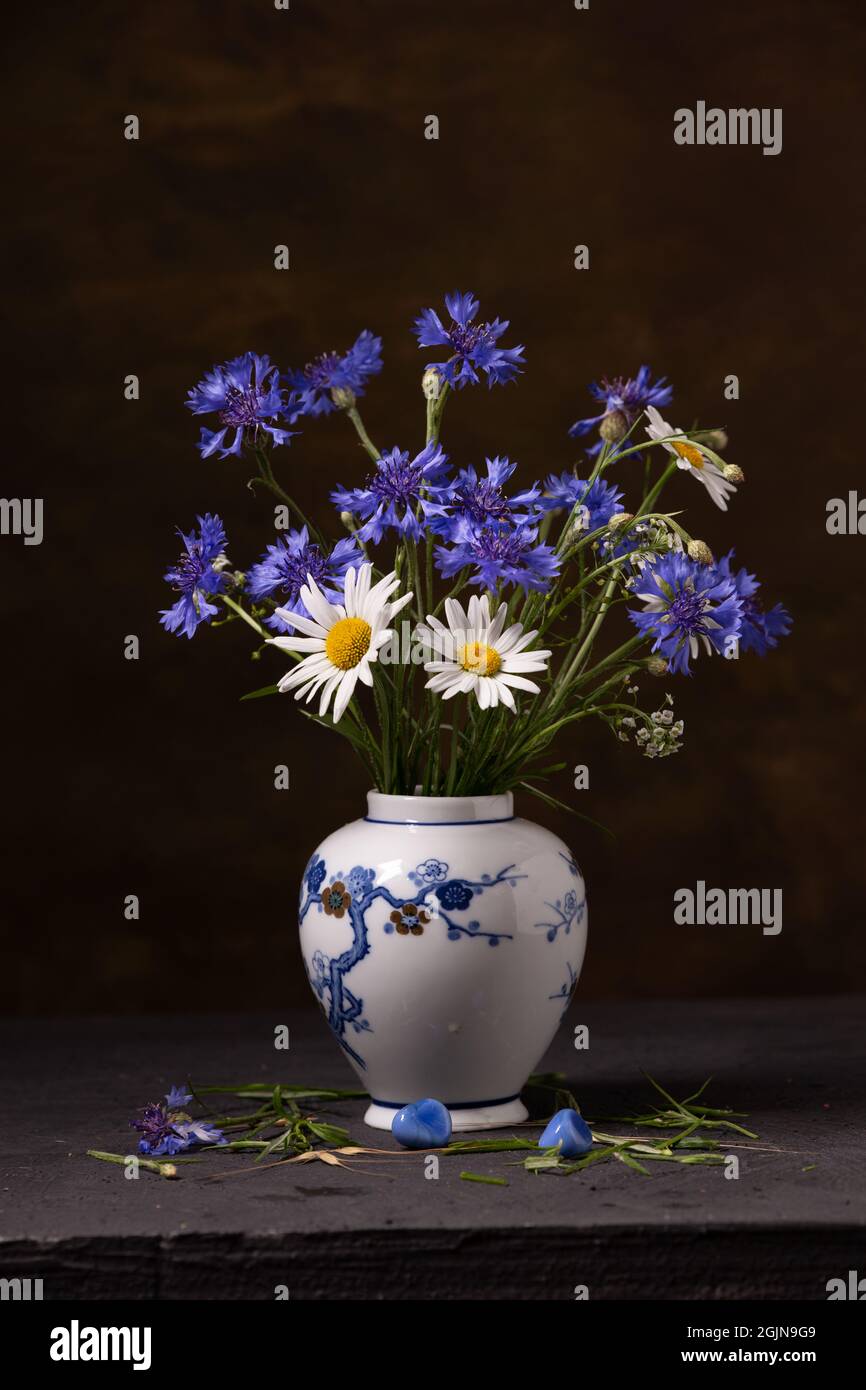 Bouquet of wild flowers in a porcelain vase Stock Photo Alamy