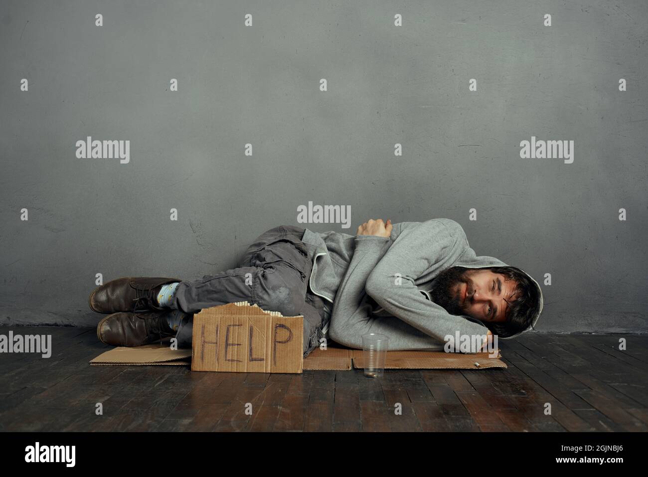 Poor man lying on floor hi-res stock photography and images - Alamy