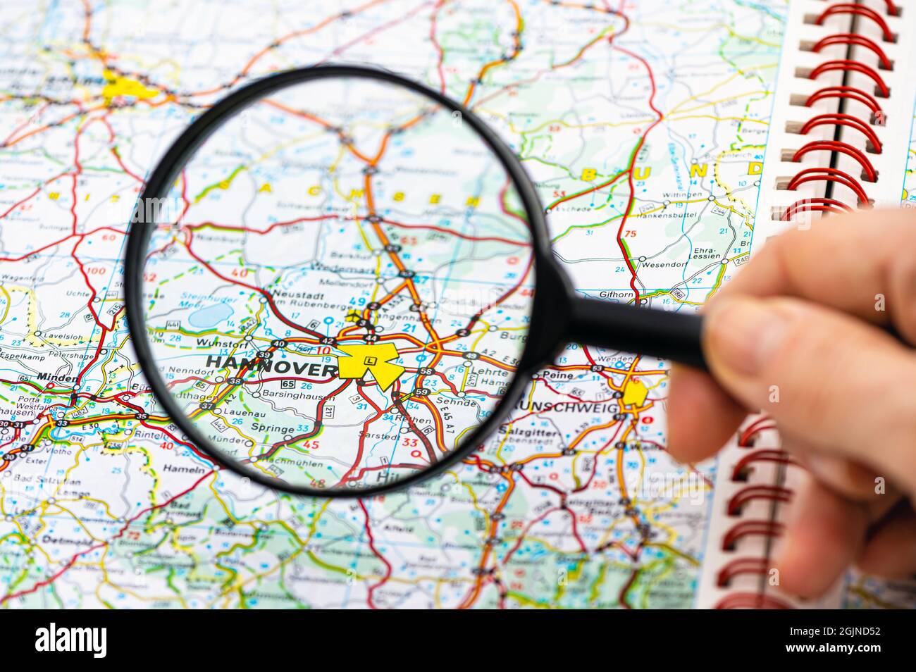 map of Hannover in Germany through magnifying glass, concept of planning the travel itinerary Stock Photo