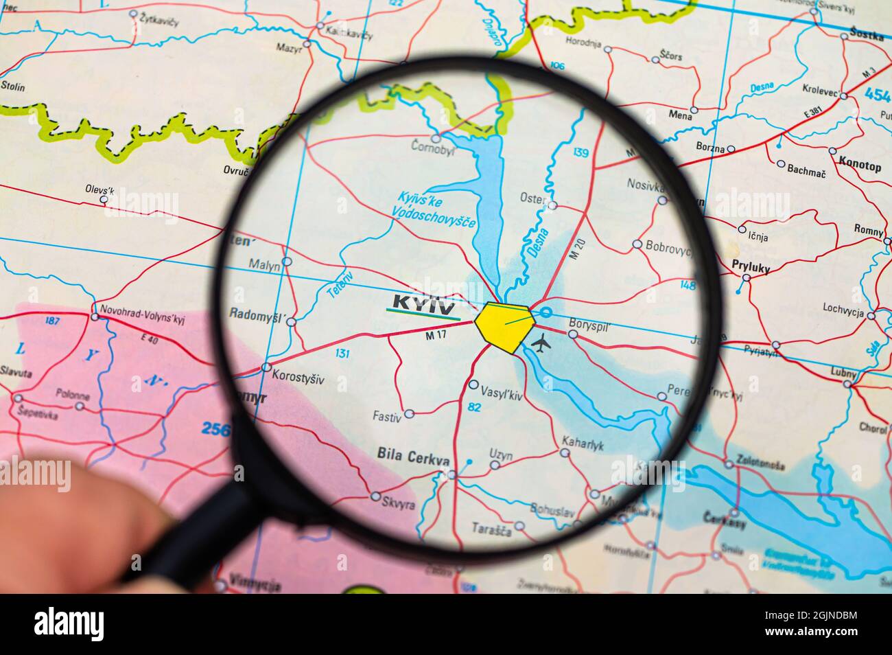 map of Kiev in Ukraine through magnifying glass, concept of planning the travel itinerary Stock Photo