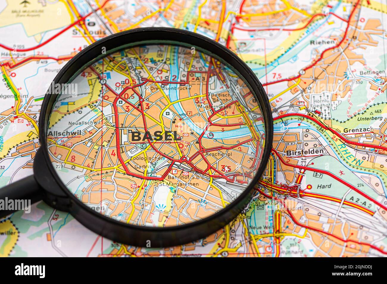 map of Basel in Switzerland through magnifying glass, concept of planning the travel itinerary Stock Photo
