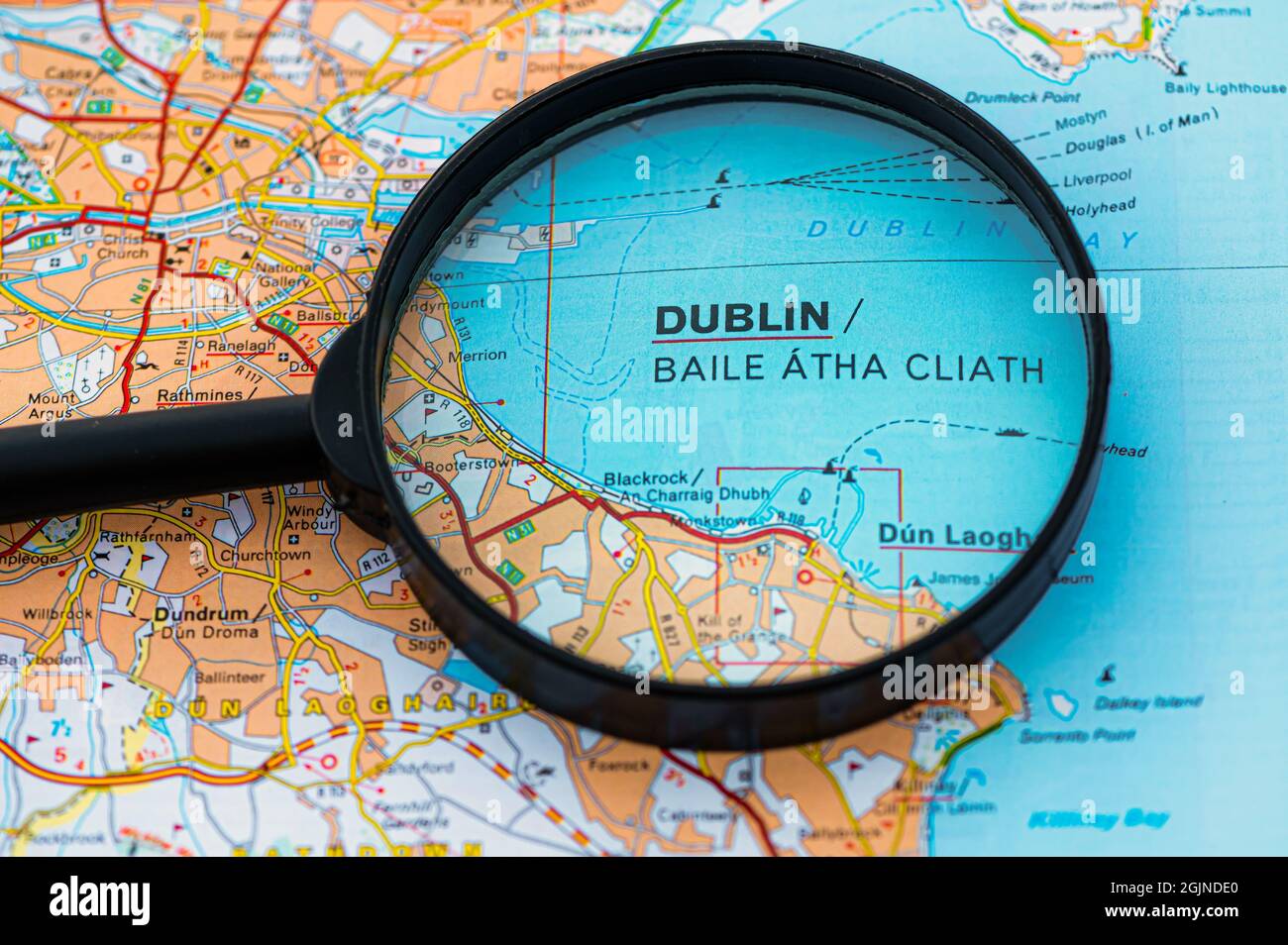 map of Dublin in Ireland through magnifying glass, concept of planning the travel itinerary Stock Photo