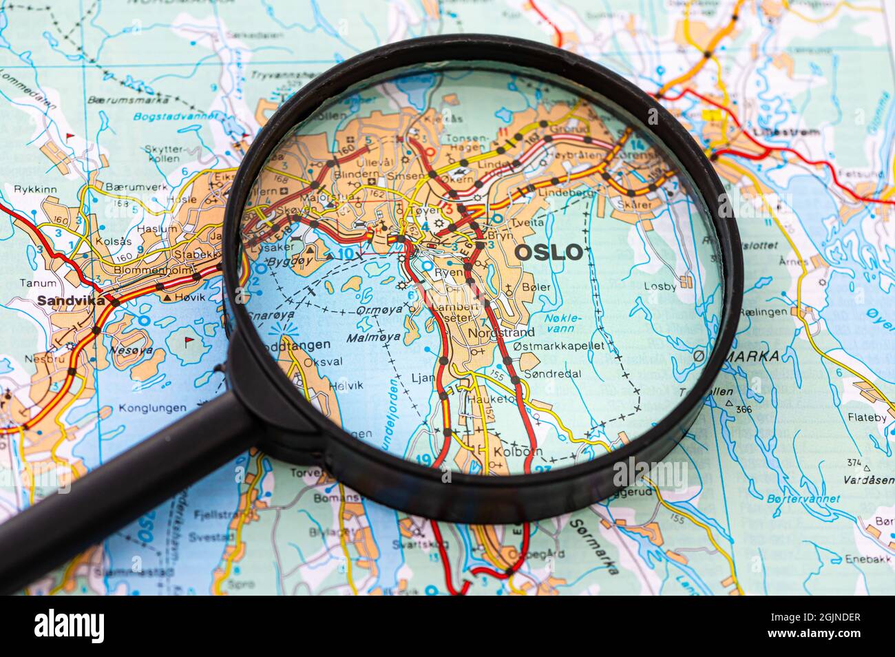 map of Oslo in Norway through magnifying glass, concept of planning the travel itinerary Stock Photo