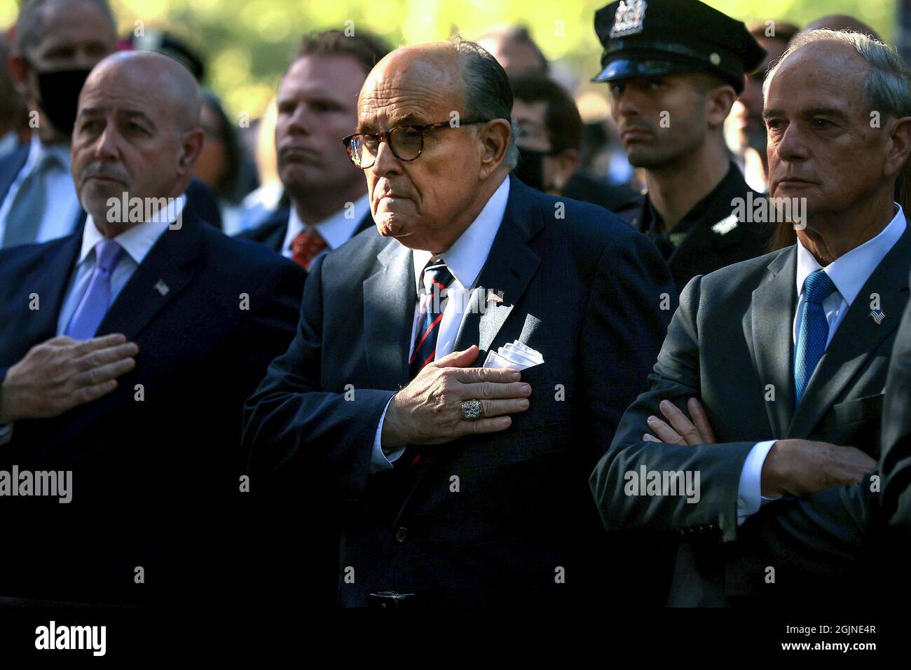 New York, USA. 11th Sep, 2021. Former New York City Mayor Rudy Giuliani (C) attends the 9/11 Commemoration Ceremony at the National 9/11 Memorial and Museum in New York City, N.Y., on September 11, 2021. Six moments of silence were held marking when each of the World Trade Center towers was struck and fell and the times corresponding to the attack on the Pentagon and the crash of United light 93 in Pennsylvania, during the 20th anniversary of the terror attacks of September 11. Pool photo by Chip Somodevilla/UPI Credit: UPI/Alamy Live News Stock Photo