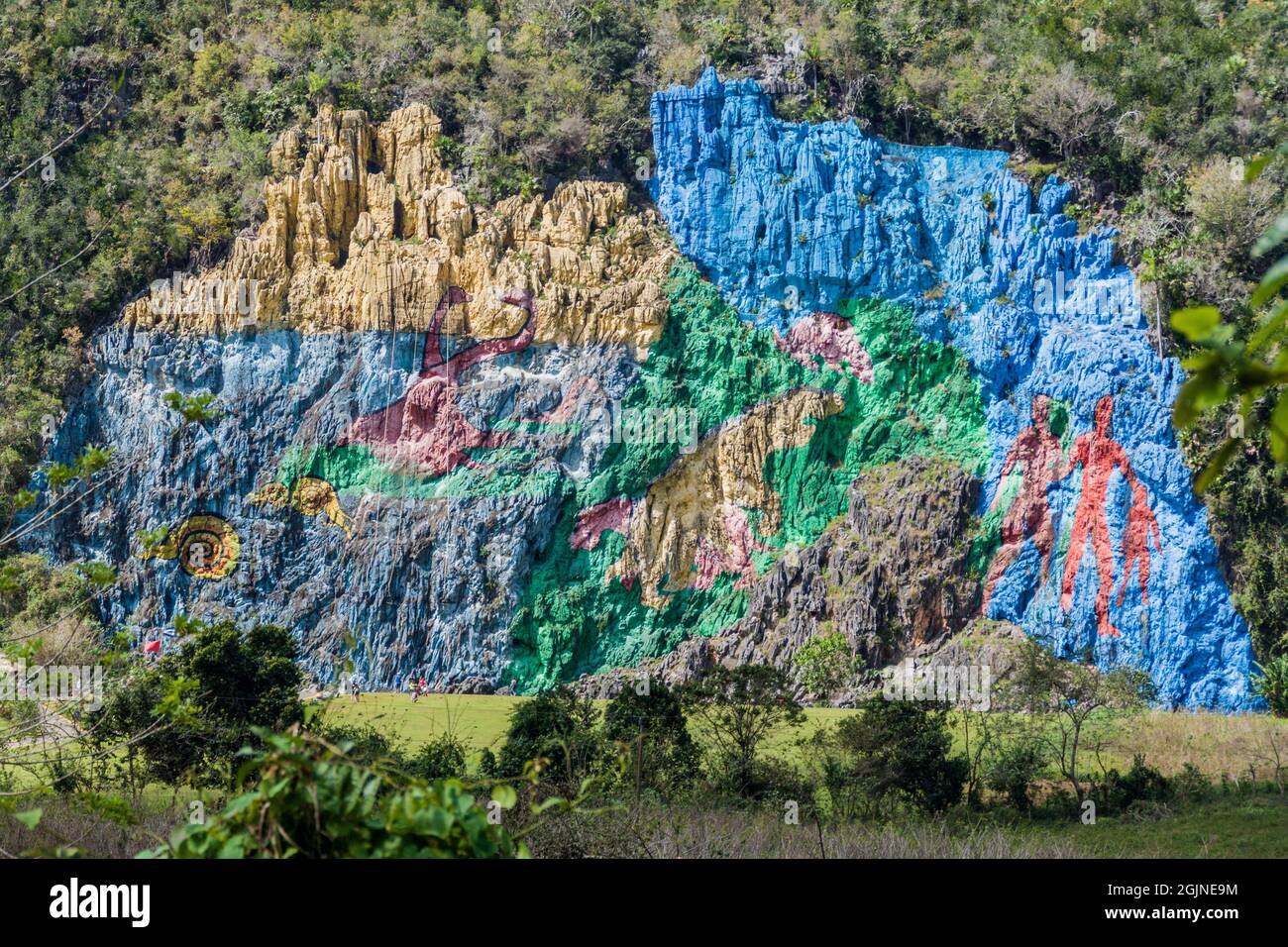 Mural de la Prehistoria The Mural of Prehistory painted on a cliff face in the Vinales valley, Cuba. Stock Photo