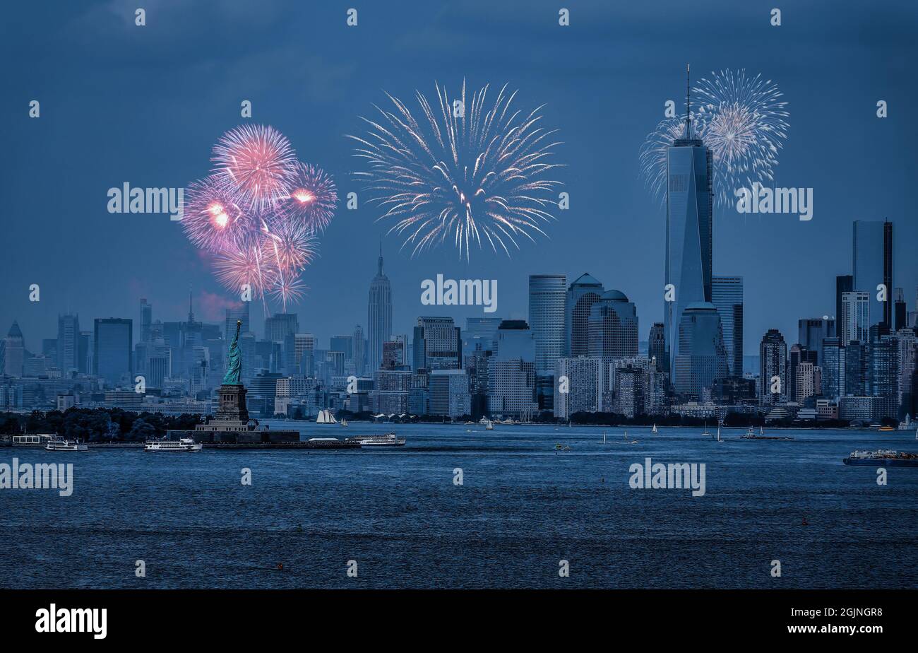 Statue of Liberty and Freedom Tower During Fireworks Stock Photo