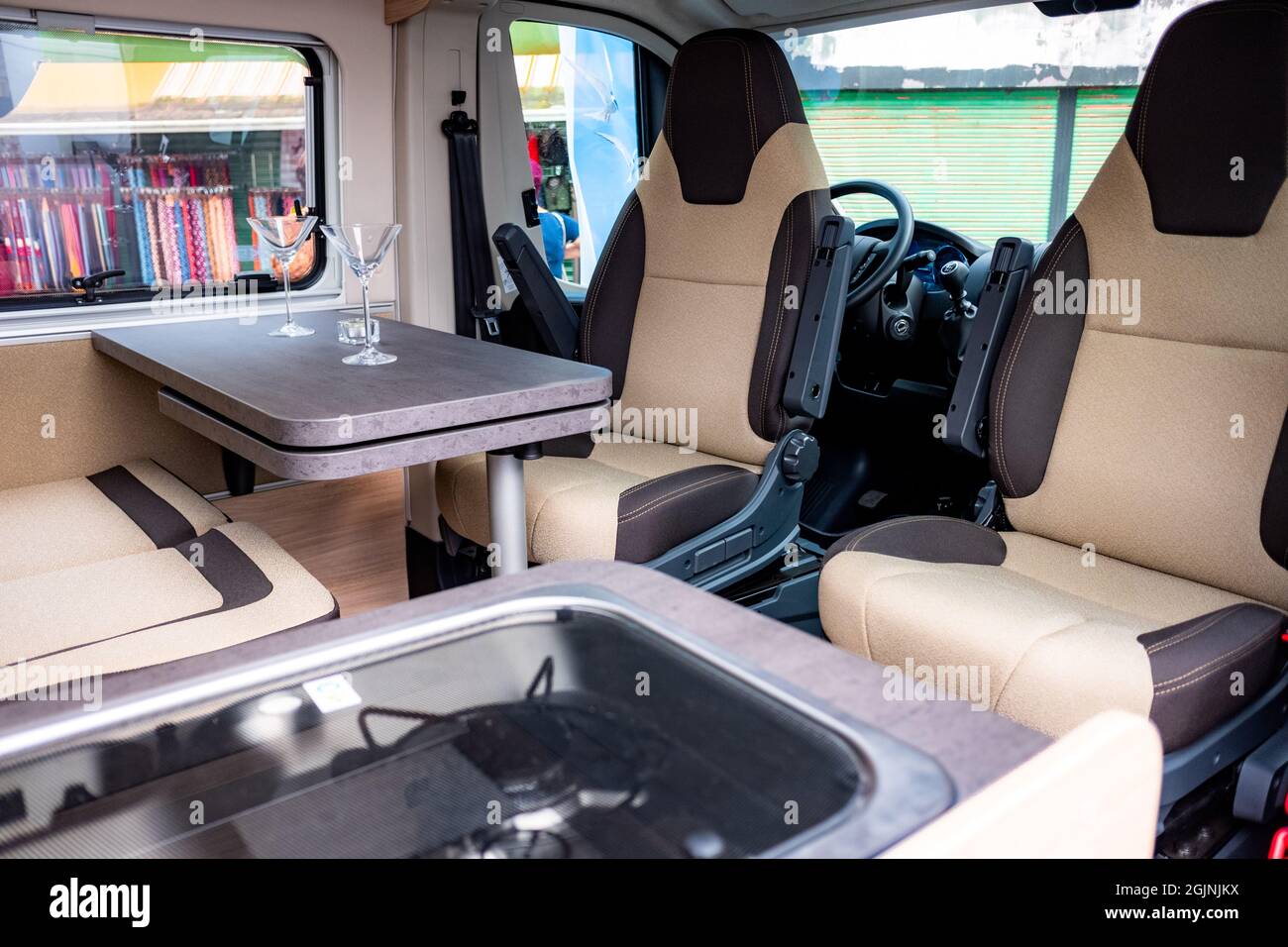 Small table with glasses on it in a car parked outdoors Stock Photo - Alamy