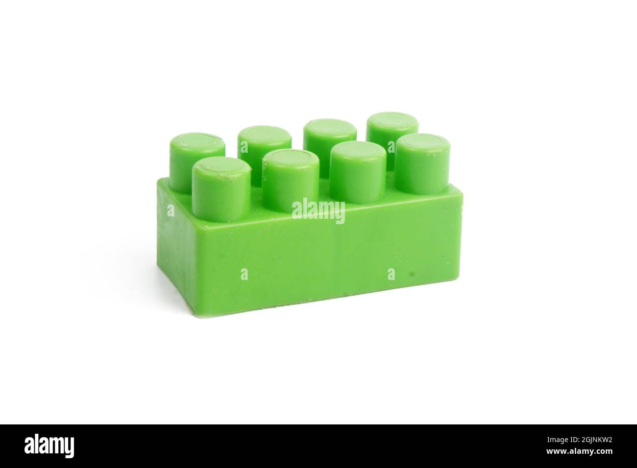 a green block from a children's building constructor set, isolated on a ...