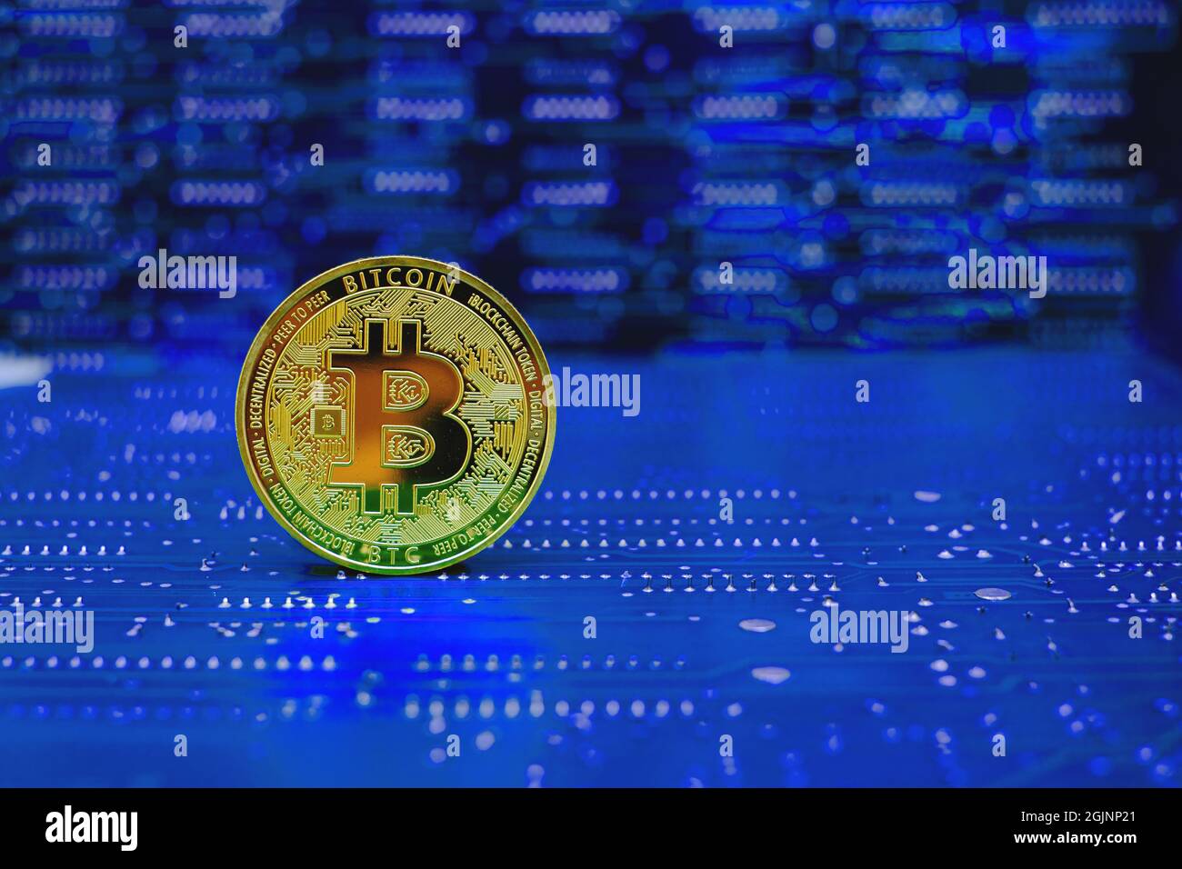 Golden bitcoin cryptocurrency new version on computer electronic circuit board background Stock Photo
