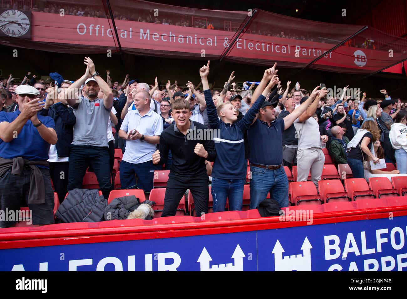 Fans of Peterborough celebrate the goal scored by Jack Marriott 14 of