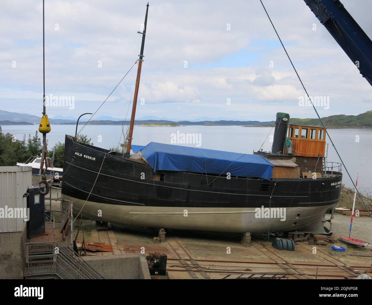 View of Auld Reekie, VIC 27, on the slipway at Crinan Boatyard where she's being restored to her former glory as a 66ft long Clyde steam puffer. Stock Photo