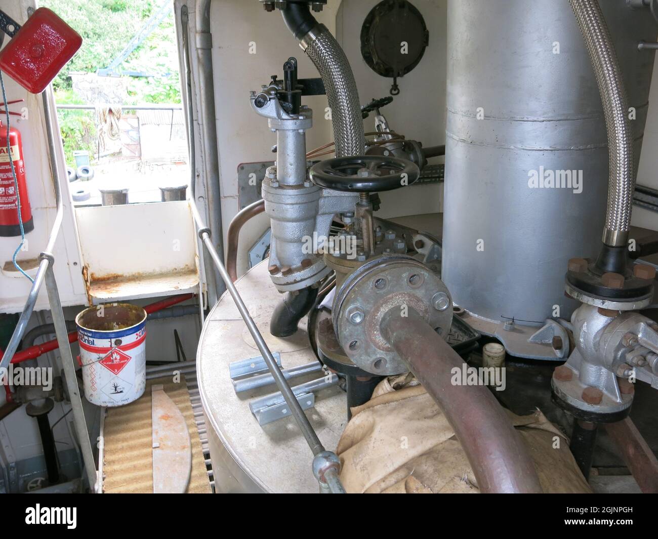 Restoration of Clyde Puffer steam boat, Auld Reekie, at Crinan Boatyard continues: close-up of the new boiler in the engine room, August 2021 Stock Photo