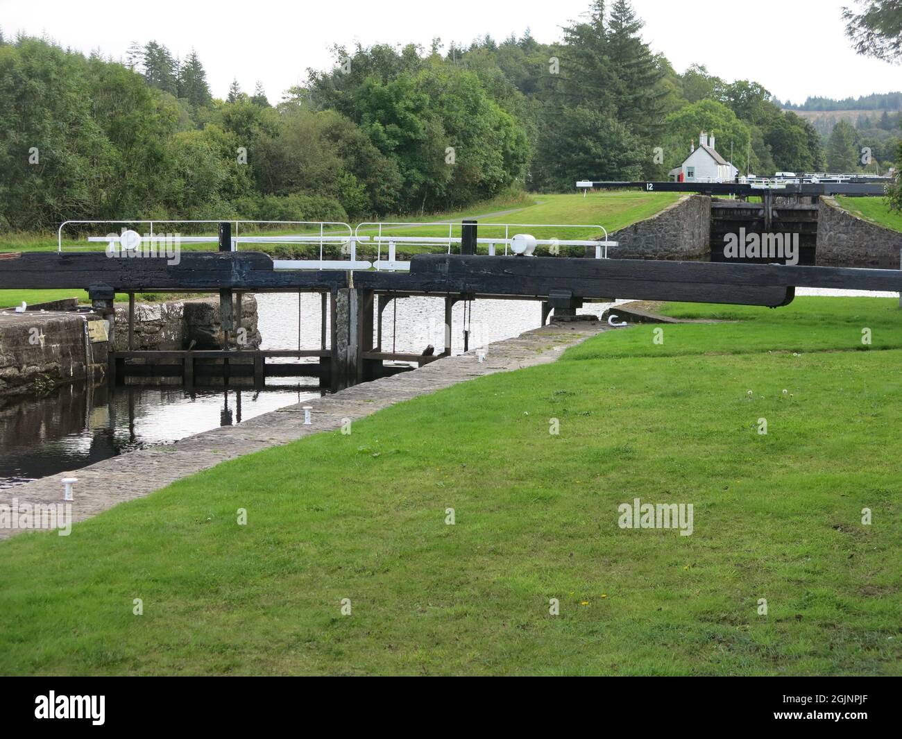 View of the flight of lock gates on the Crinan Canal at Dunardry, about halfway along the nine miles of inland waterway across the Kintyre Peninsula. Stock Photo