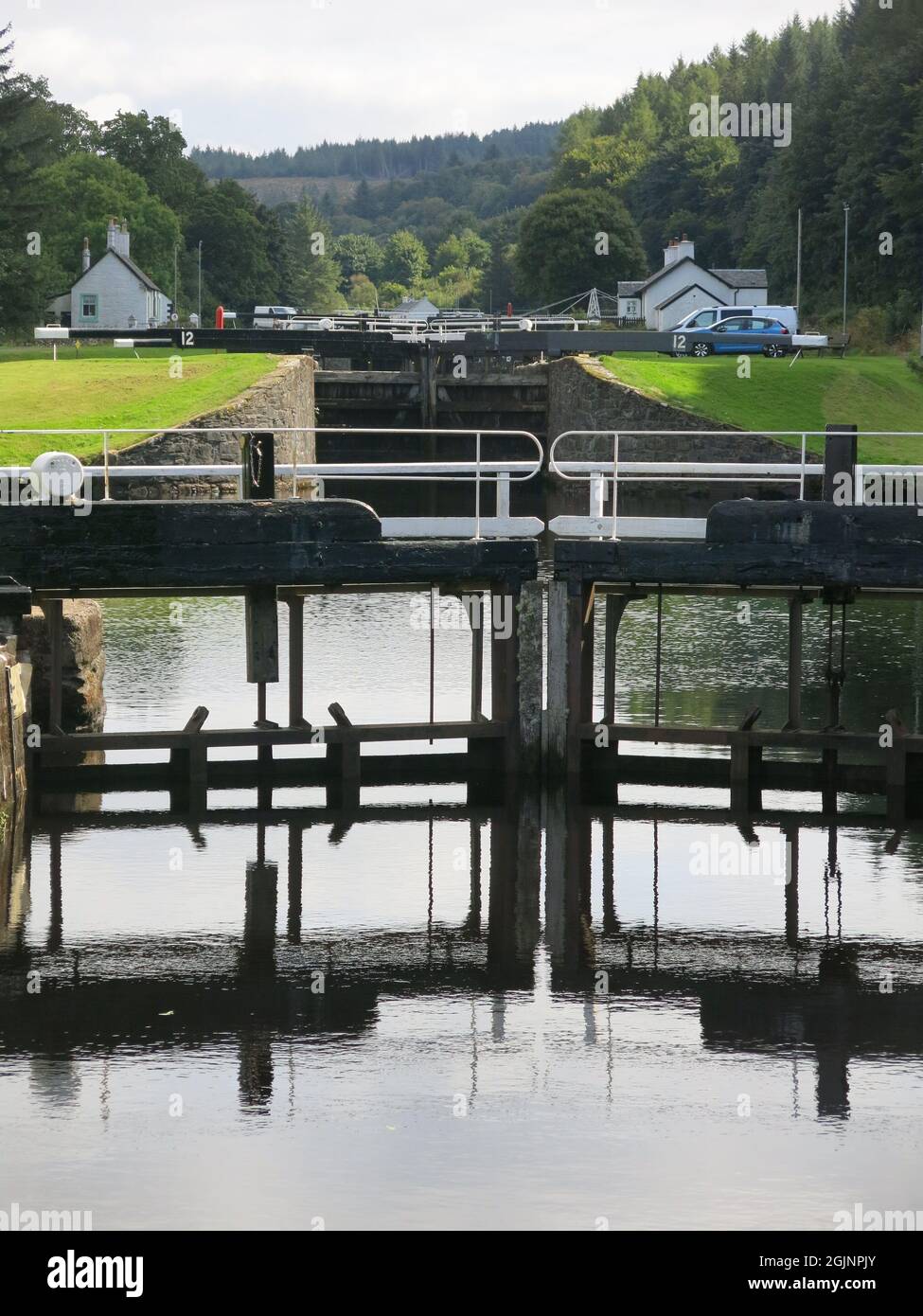 View of the flight of lock gates at Dunardry on the Crinan Canal, which provides a navigable waterway across the Kintyre Peninsula to the west coast. Stock Photo