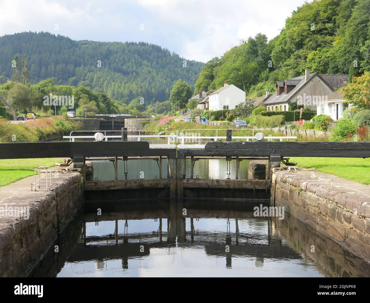 View of the flight of lock gates at Dunardry on the Crinan Canal, which provides a navigable waterway across the Kintyre Peninsula to the west coast. Stock Photo