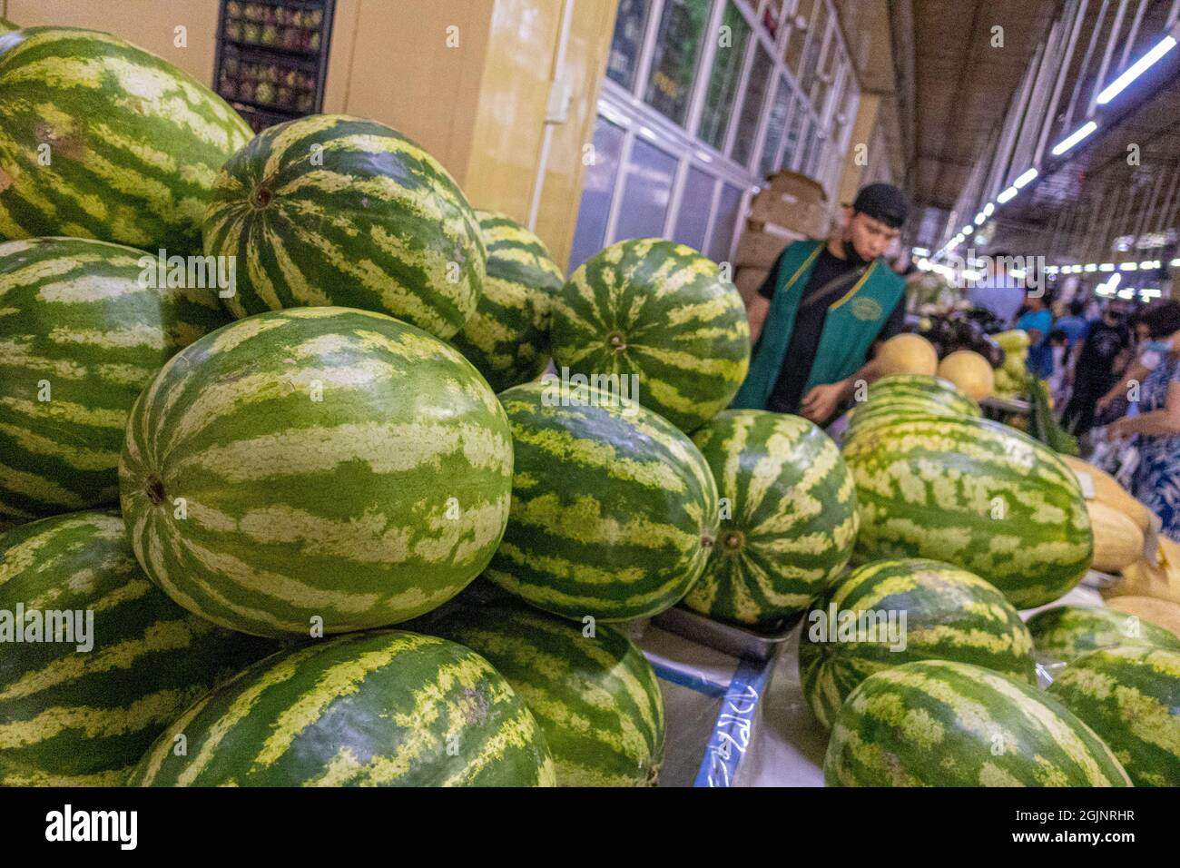 Watermelons on display sold in the indoors market in Astana, Nur-Sultan, Kazakhstan Stock Photo