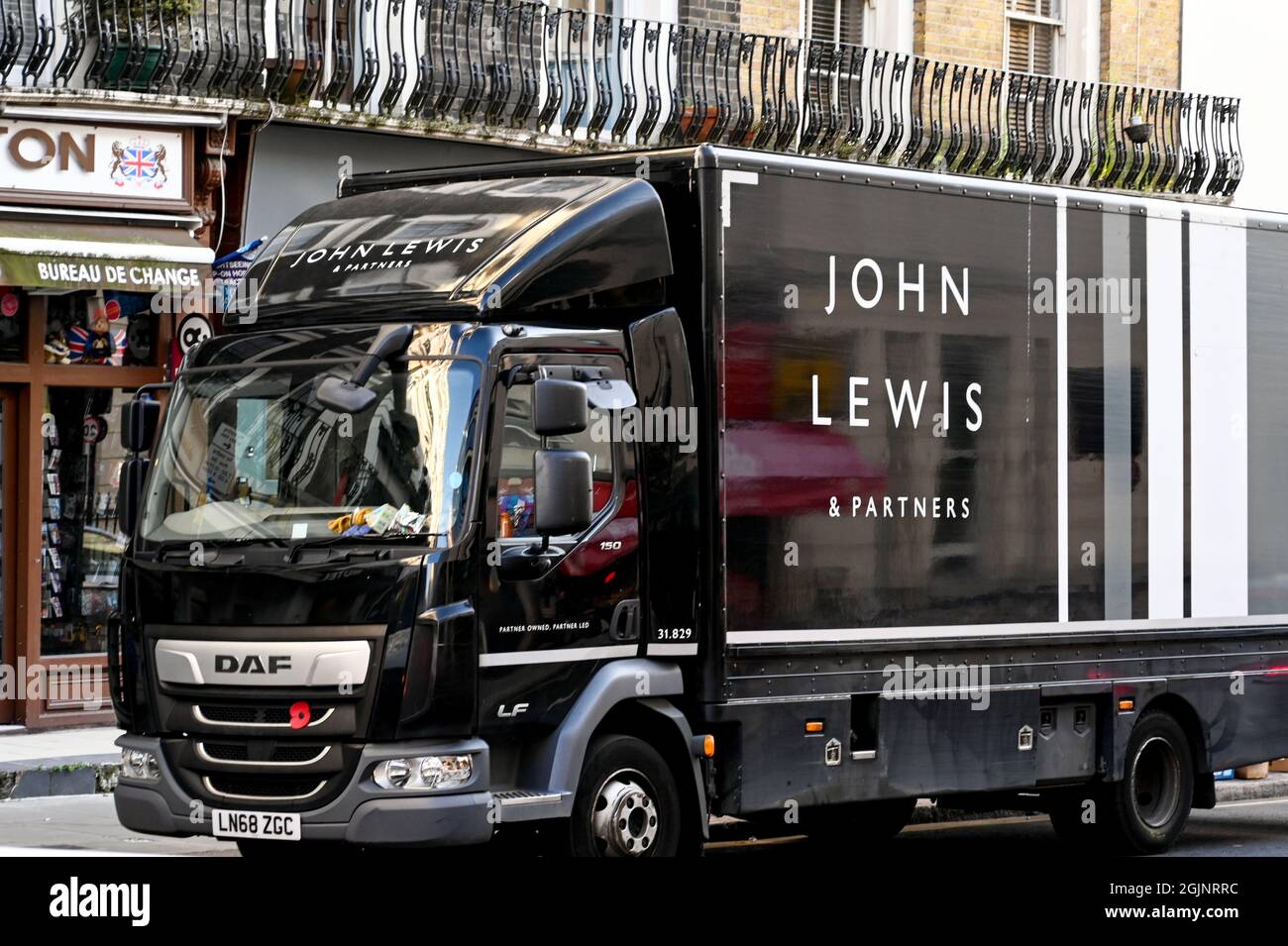 London, England - August 2021: Delivery lorry for the John Lewis  Partnership driving on the streets of London Stock Photo - Alamy