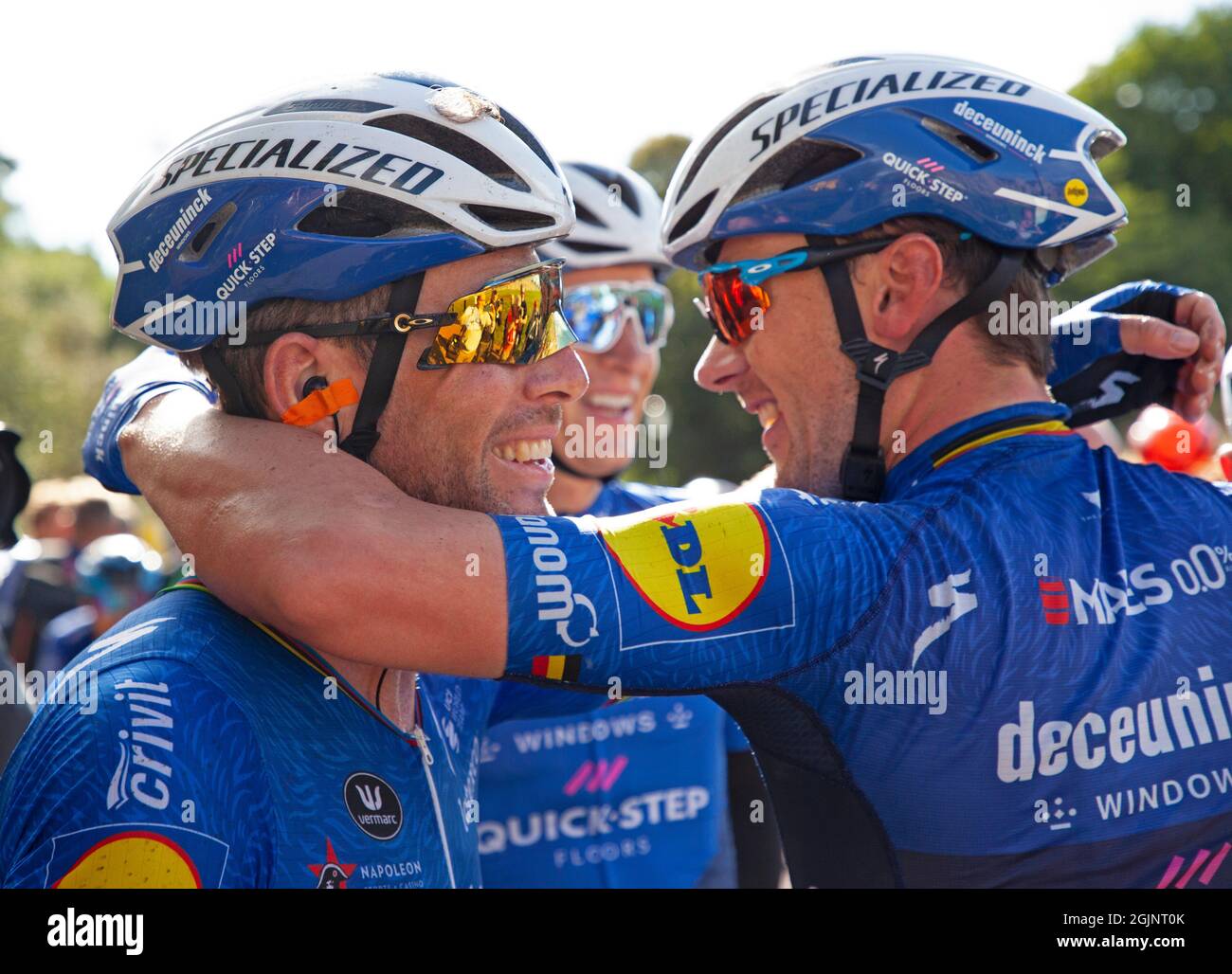 Edinburgh, Scotland, UK. 11th September 2021.  AJ Bell Tour of Britain, 7th leg, finishing in Holyrood Park. Belgian rider Yves Lampaert took Deceuninck – Quick-Step’s first victory of this tour. Pictured: Mark Cavendish celebrates with team mates. Stock Photo