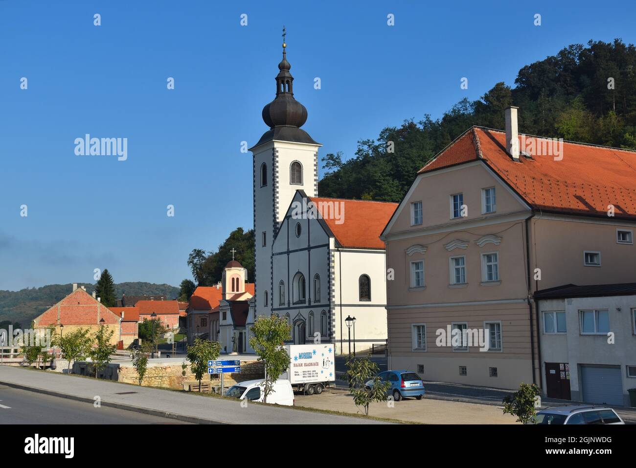 Hrvatska Kostajnica in Croatia, border town with Bosnia, Una river; catholic and orthodox churches side by side Stock Photo