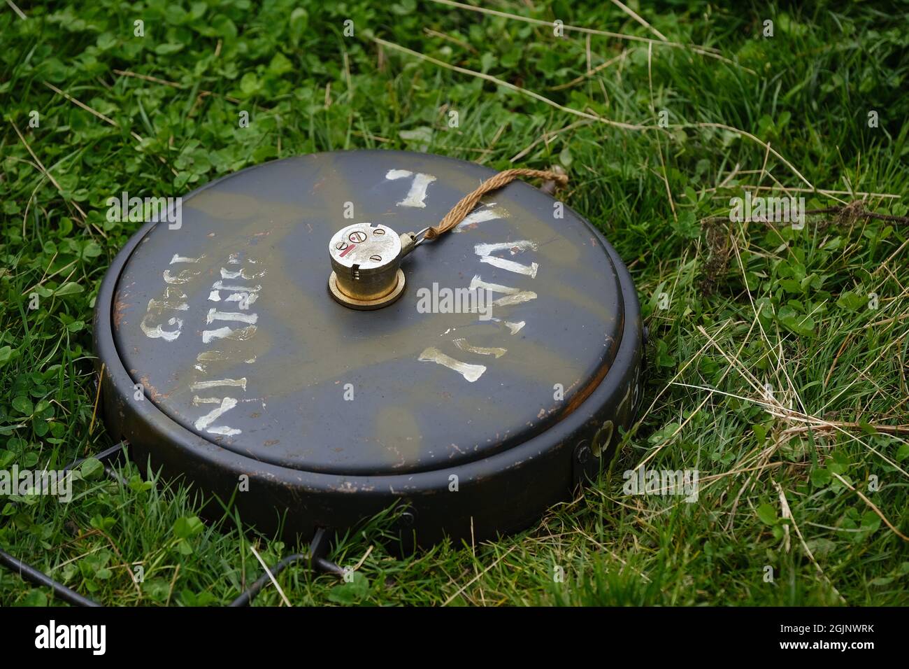 An anti-tank mine (abbreviated to 'AT mine') is a type of land mine designed to damage or destroy vehicles including tanks and armored fighting vehicl Stock Photo