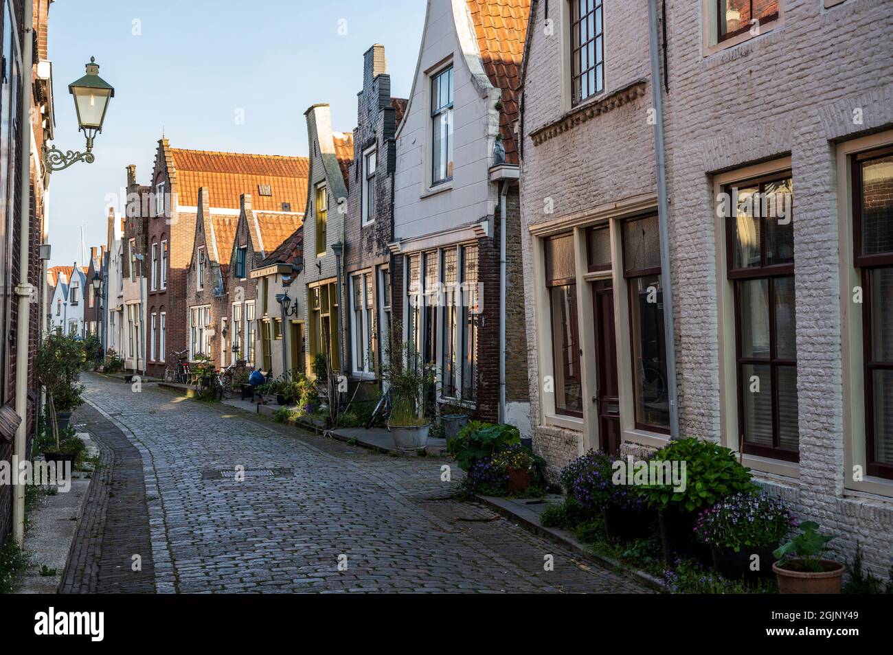 Walking in old Dutch town Zierikzee with old small houses and
